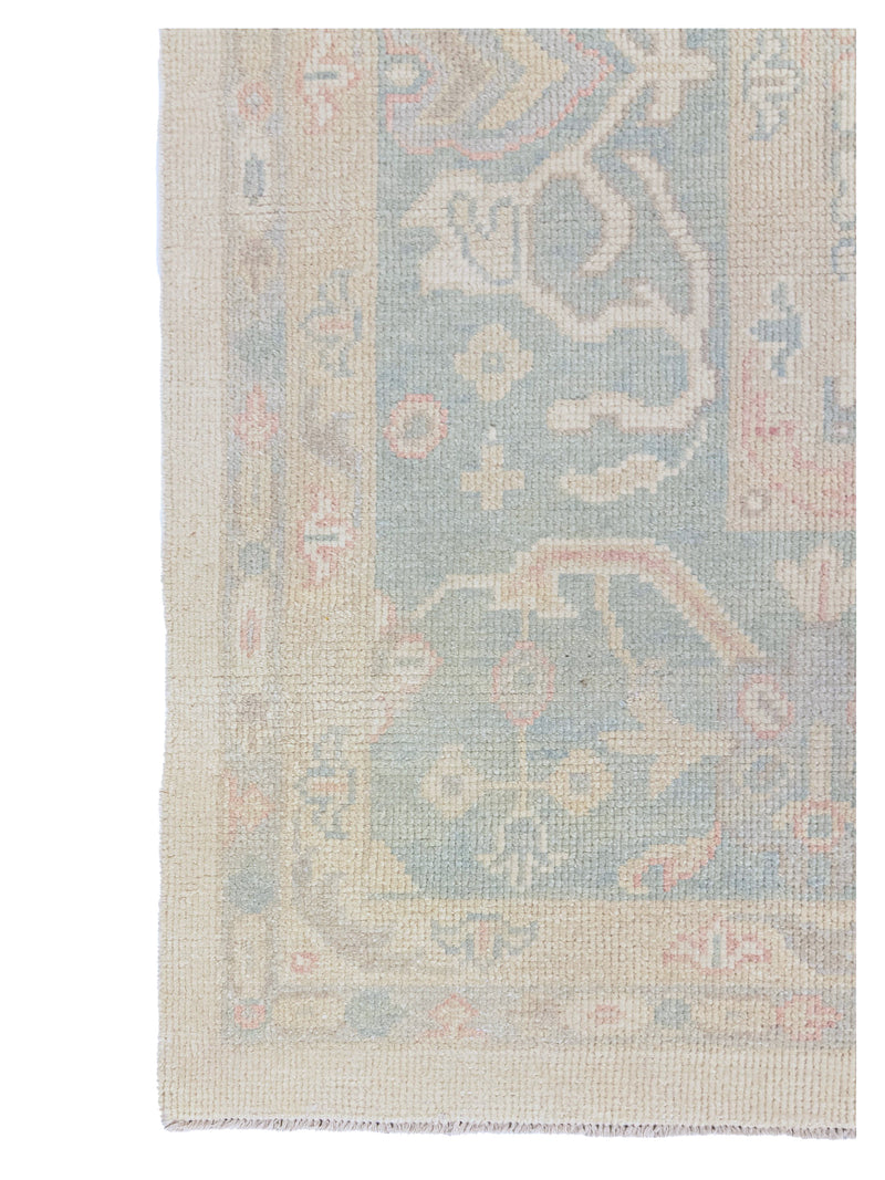 Decorative rug with intricate pattern on a plain background
