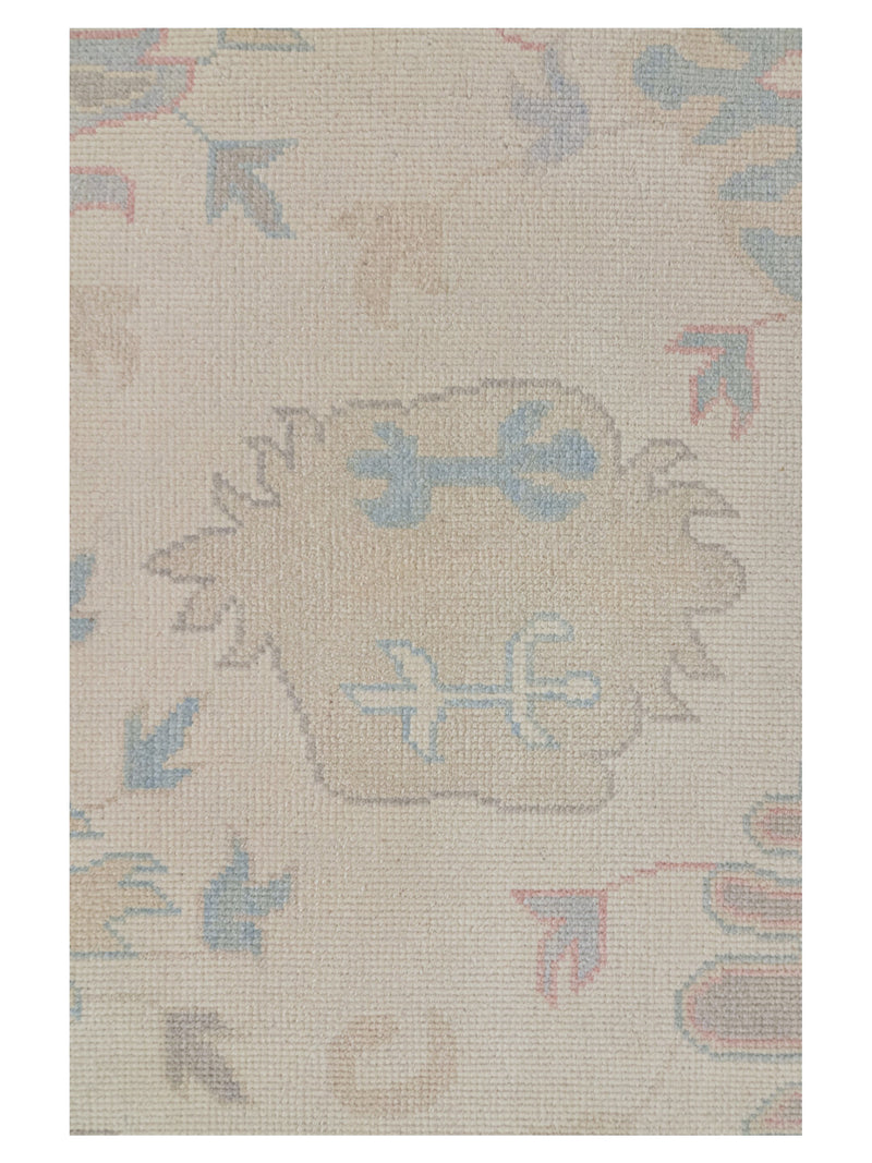 Beige rug with decorative patterns on a plain background
