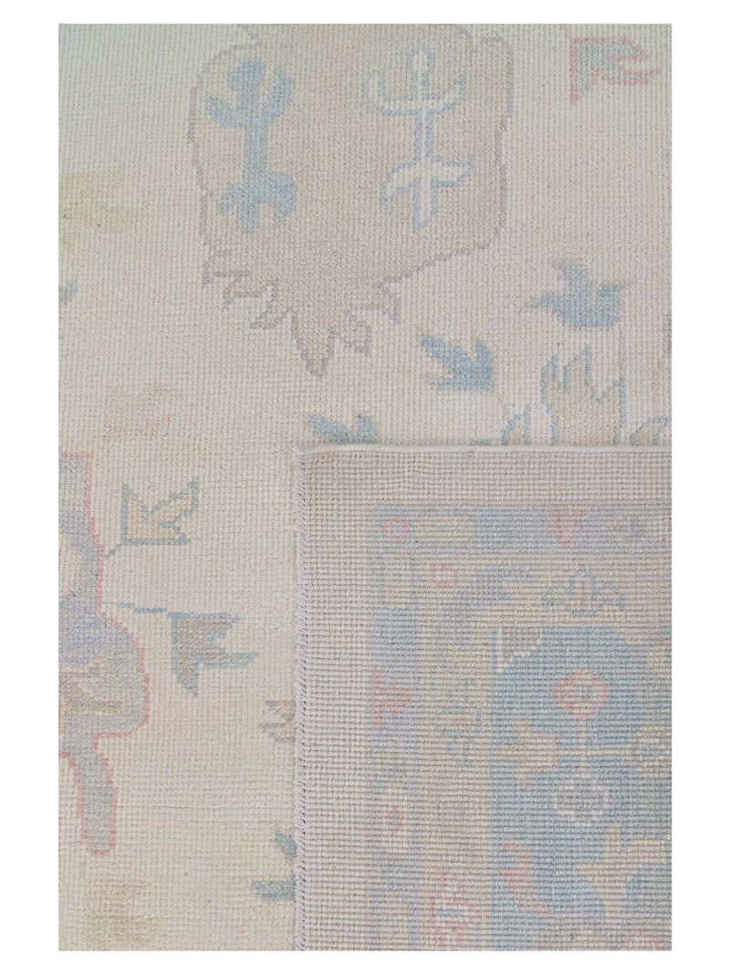 Textured fabric with abstract patterns in beige, blue, and brown on a white background