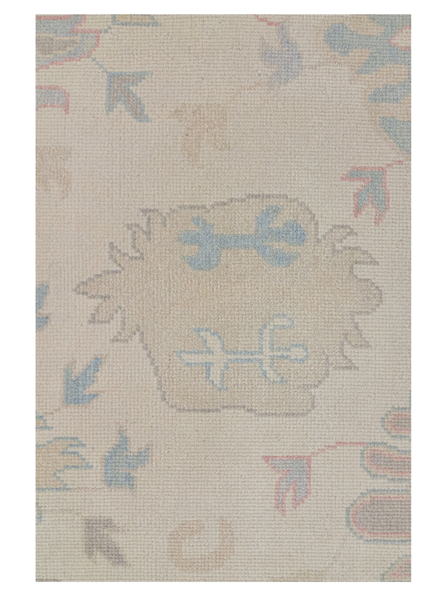 Beige rug with decorative patterns on a plain background