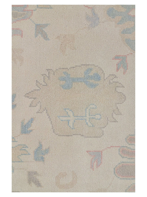Beige rug with decorative patterns on a plain background