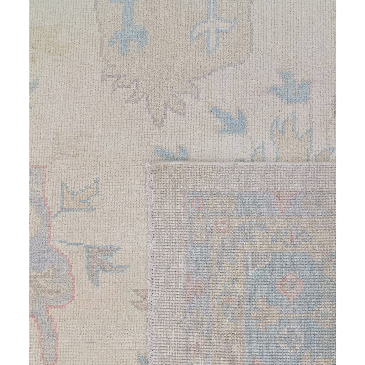Textured fabric with abstract patterns in beige, blue, and brown on a white background