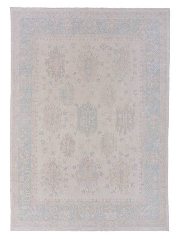 Beige area rug with subtle pattern on a plain background